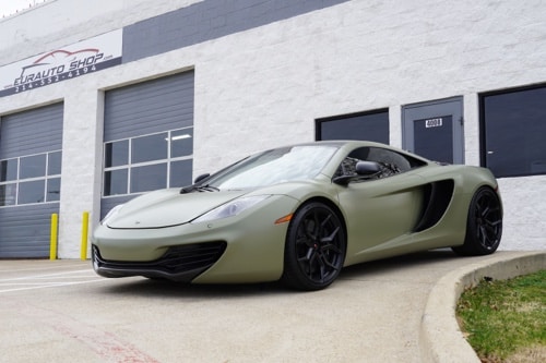 EurAuto Shop in Plano Tx, Mclaren auto repair and service; army green mclaren that was serviced at the shop is pictured outside of office door at the shop