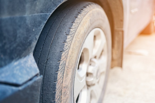 Care use unsafe tire, change time for a front wheel rubber worn, bald, black, old and low tread car tires. Driving on worn tires is a safety hazard