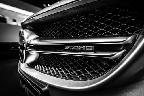 Specializing in European Auto Repair in Plano, TX closeup image of the front grill on a black mercedes-benz AMG series