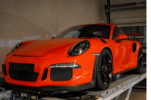 Ready to Dream Big? Take a Look at the Porsche 991.2 GT3 RS for auto repair at EurAuto Shop in Plano TX; red porsche on lift in shop