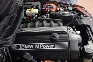 3 Common Causes for BMW Repair | EurAuto Shop in Plano, TX. Closeup image of a BMW engine and other component under the hood.
