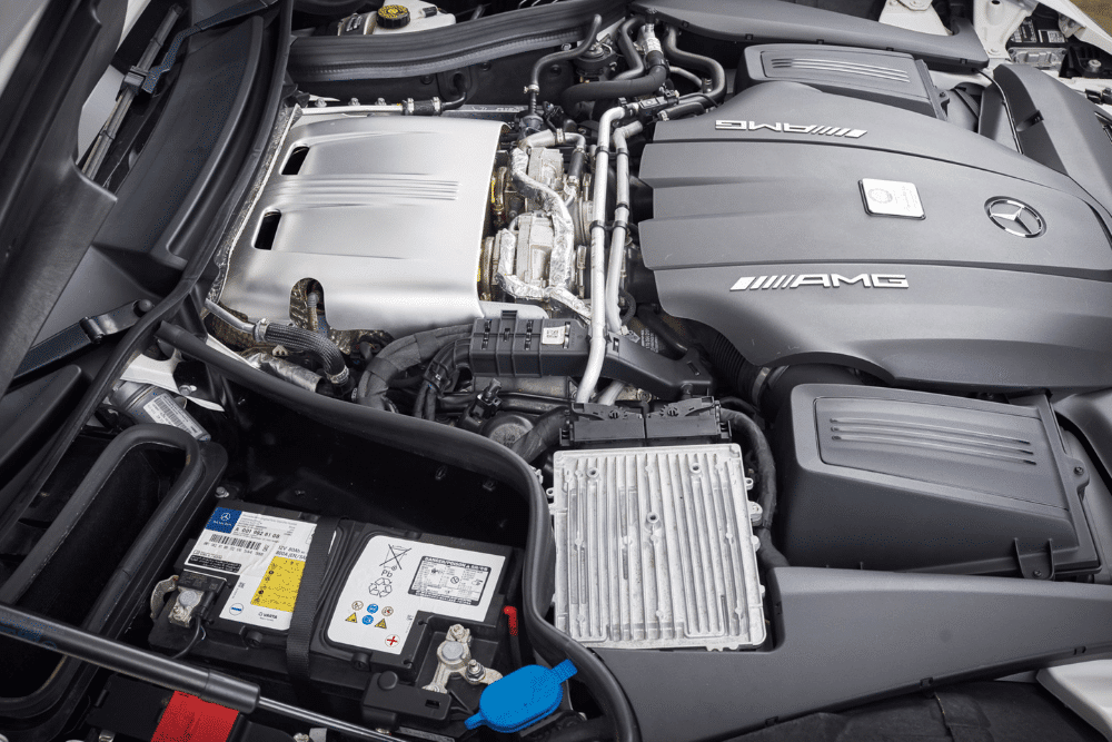 Auxiliary battery issue, European auto repair in Plano, TX at EurAuto Shop. Mercedes-AMG engine bay with a visible auxiliary battery.