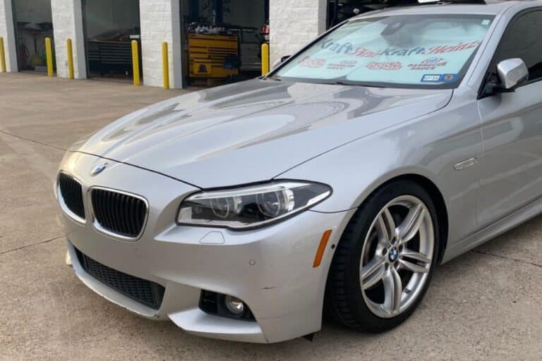 BMW Maintenance in Plano TX At EurAuto Shop. Silver BMW parked outside a professional auto repair shop for maintenance