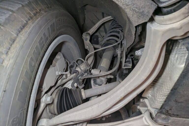 Suspension Inspection, Suspension Repair In Plano TX At EurAuto Shop. Close-up view of a car suspension system