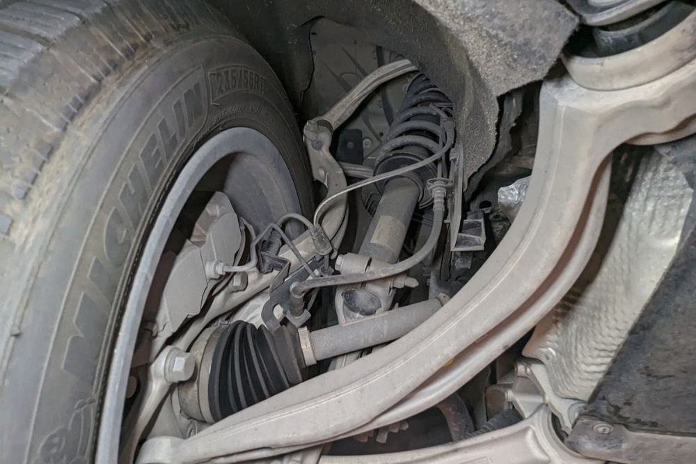 Suspension Inspection, Suspension Repair In Plano TX At EurAuto Shop. Close-up view of a car suspension system