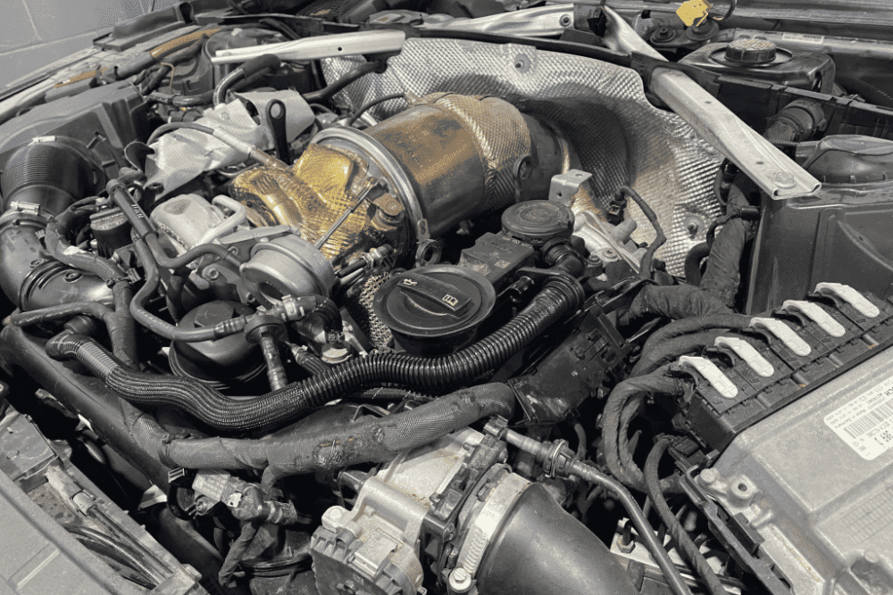 Cooling System Inspections for European Cars in Plano by EurAuto Shop -- a close up of a European car's engine during maintenance