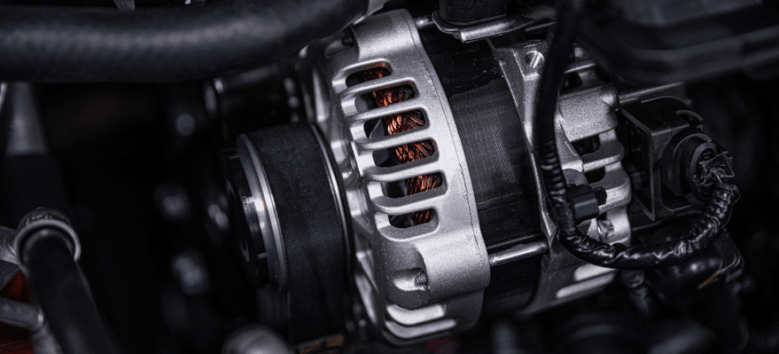 Alternator failure, auto repair in Plano, TX, at EurAuto Shop. A close-up image of a vehicle alternator inside the engine bay, highlighting a key charging system component inspected during professional alternator diagnosis and electrical system repair.